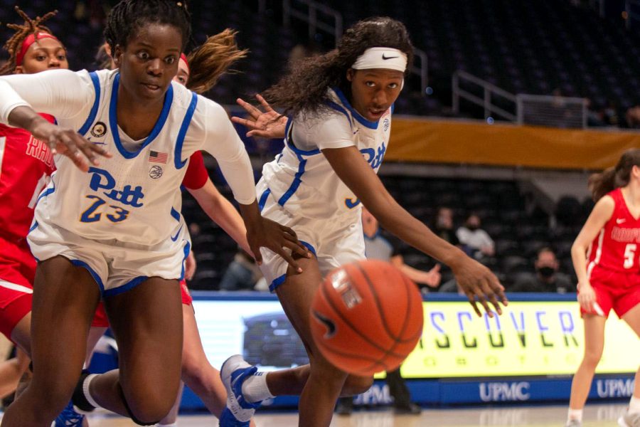 Pitt junior center Rita Igbokwe (23), left, and sophomore guard Taisha Exanor (3) chase the ball at a Nov. 21, 2021, game against Radford University at the Petersen Events Center.