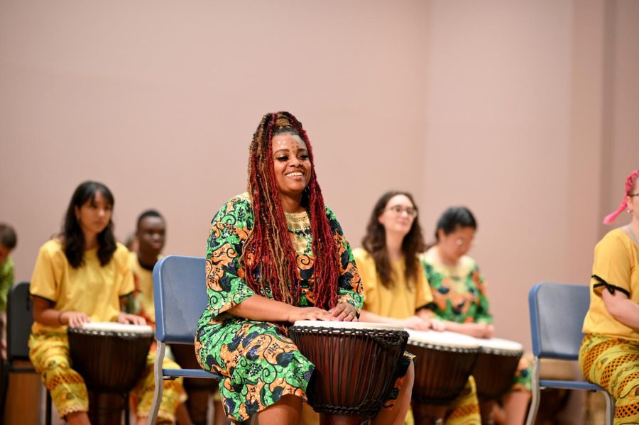 A Pitt student drums during the Pitt African Music and Dance Ensemble’s concert in Bellefield Hall on Friday.  