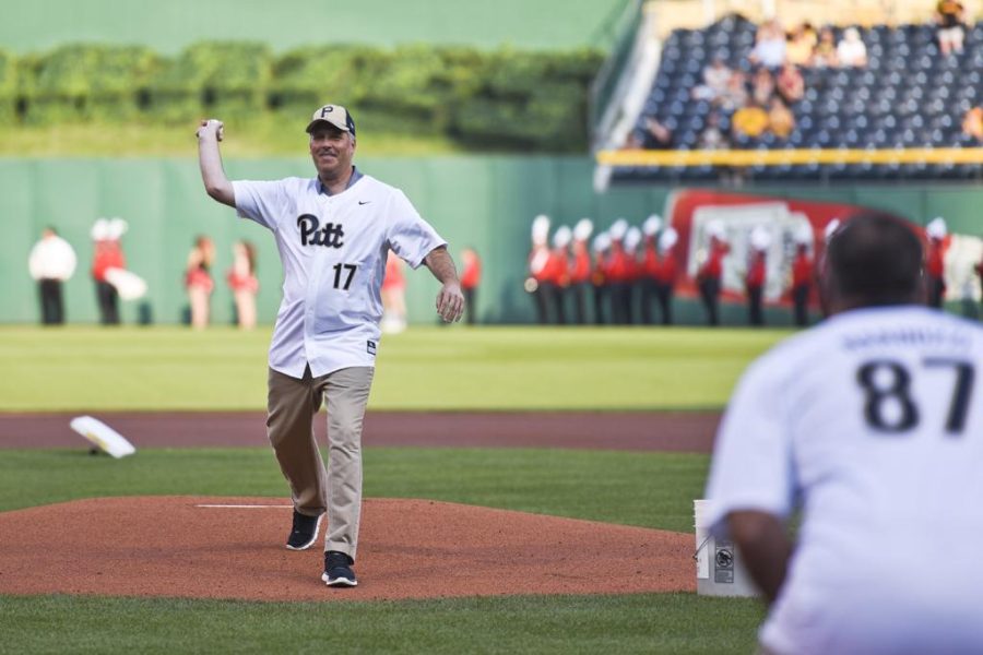 Pitt Chancellor Patrick Gallagher throws the first pitch at the Pittsburgh Pirates Pitt Night in July 2016.