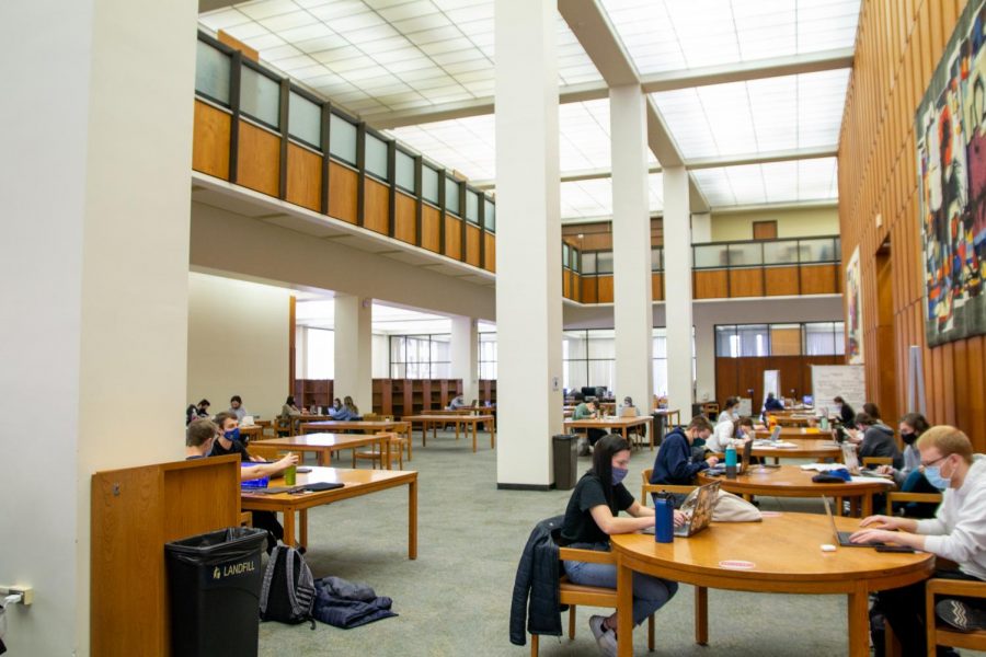 Students study on the first floor of Hillman Library.
