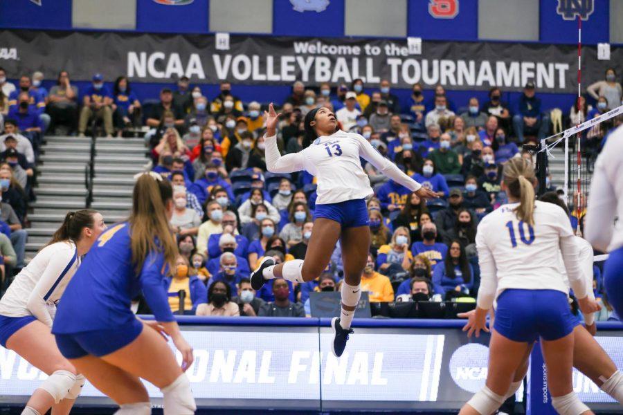 Leketor Member-Meneh (13) jumps to spike the ball during the Pitt vs. Purdue matchup in the NCAA womens volleyball tournament in Dec. 
