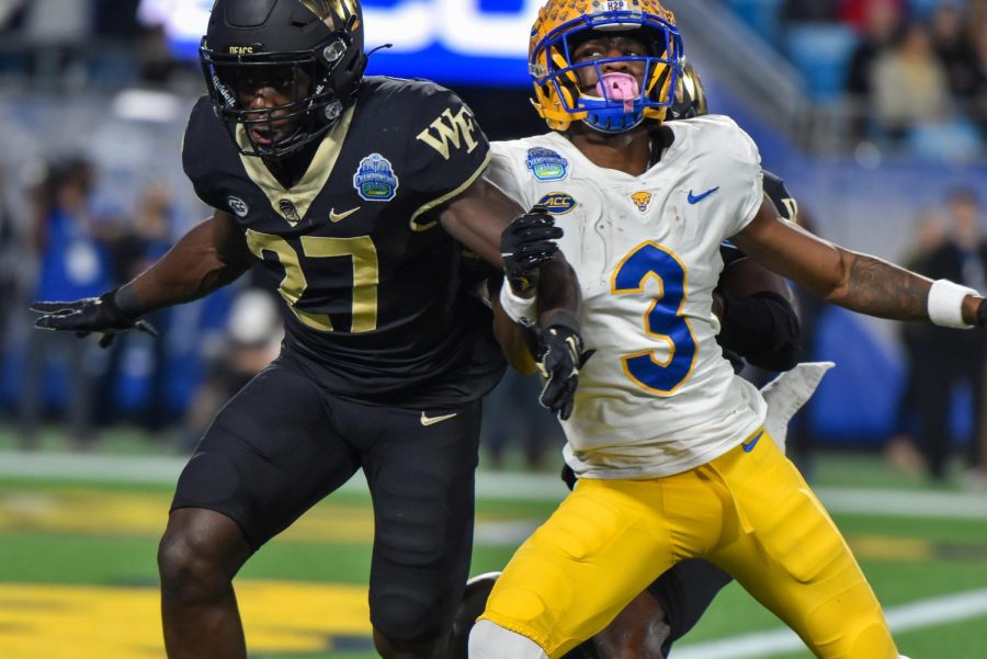 Pitt junior wide receiver Jordan Addison (3), left, attempts to catch a pass during the ACC Championship football game against Wake Forest University on Dec. 4, 2022. 
