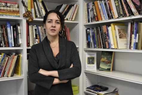 Angie Cruz, a Pitt English professor, stands in her office in 2020.