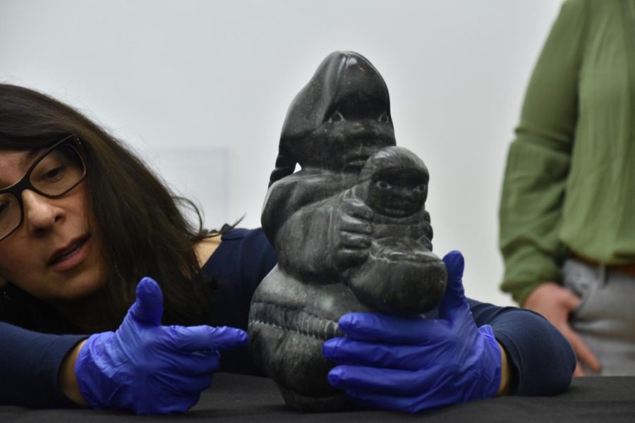 Sylvia Rhor Samneigo, a senior lecturer in the History of Art and Architecture Department discusses an Inuit sculpture Tuesday evening.