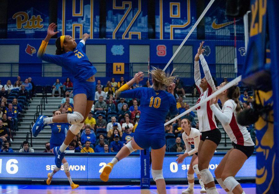Pitt graduate student middle blocker Serena Gray (21) prepares to spike the ball during Sunday’s game against NC State at Fitzgerald Field House. 
