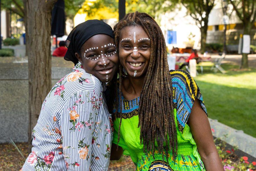 Two attendees pose outside of Posvar Hall at the Celebrate Africa Festival Saturday. 

