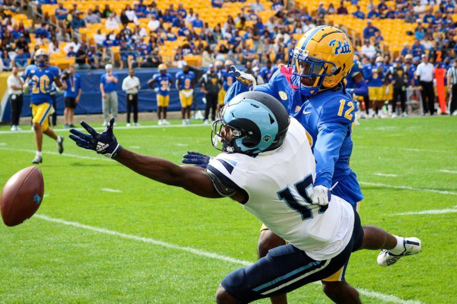 Redshirt junior defensive back M.J. Devonshire (12) prevents a completed pass to a URI wide receiver during Pitt footballs game against Rhode Island Saturday afternoon.