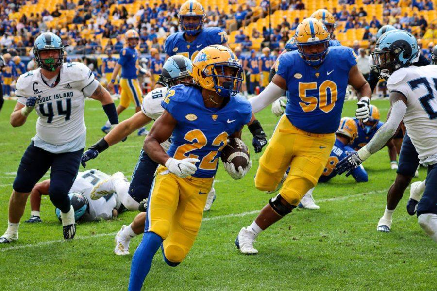 Senior+running+back+Vincent+Davis+%2822%29+runs+with+the+ball+during+Pitt+footballs+game+against+Rhode+Island+Saturday+afternoon.%0A
