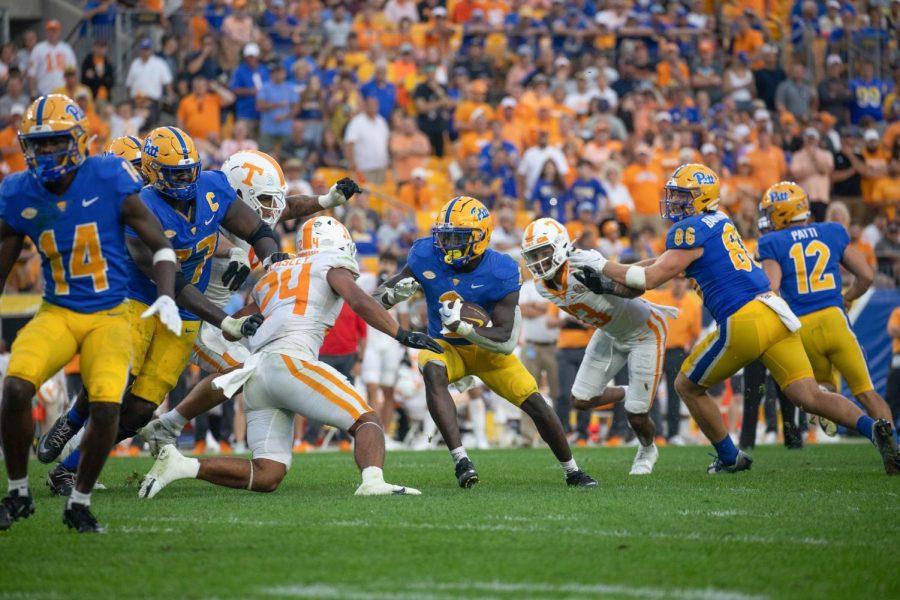 Junior running back Israel Abanikanda (2) runs the ball through a crowd of players during the Johnny Majors Classic on Sept. 10 vs. Tennessee.