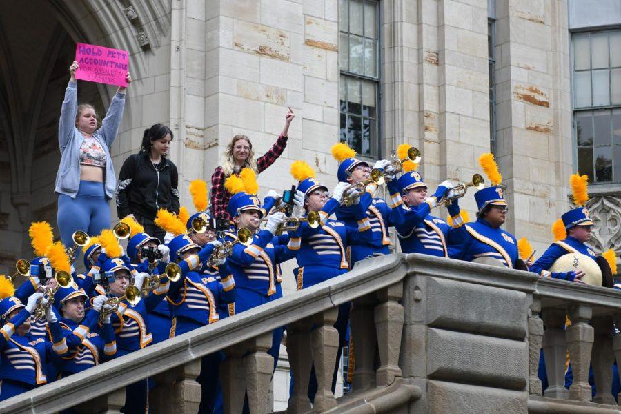 Pitt students protesting sexual violence on campus disrupt the Pitt Band snake event at the Cathedral of Learning on October 7. 
