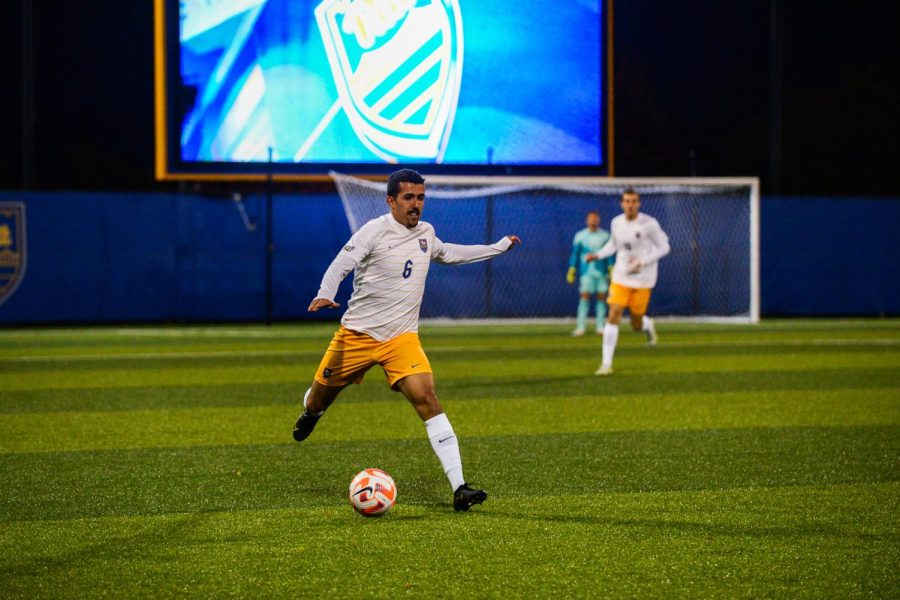 Graduate defender Lucas Rosa (6) kicks the ball during the men’s soccer game against  Duquesne Monday night.