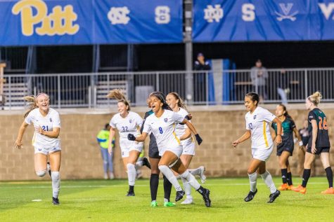 Pitt women’s soccer players celebrate after a win against Miami on Sept 22.