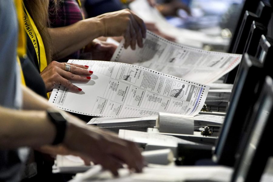 Election workers perform a recount of ballots from the Pennsylvania primary election at the Allegheny County Election Division warehouse on the North Side in June.
