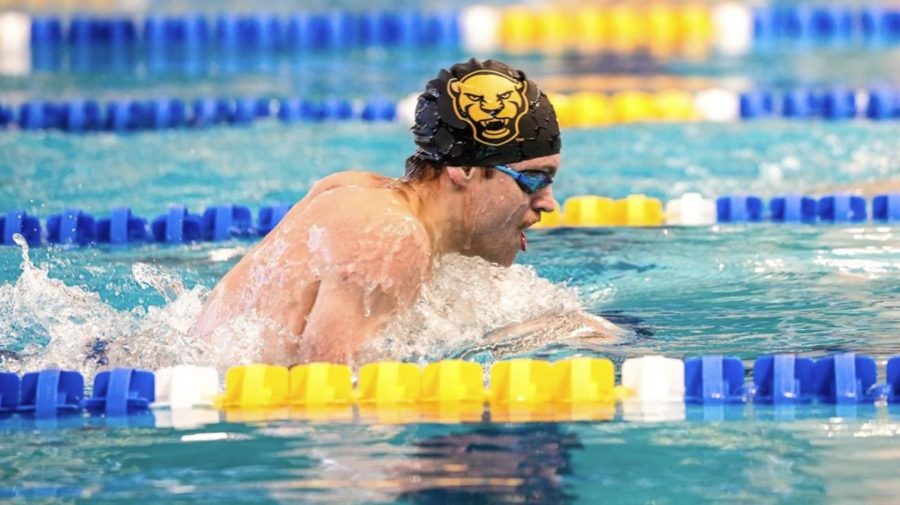 A Pitt swimmer competes during a meet against Penn State and Notre Dame on Saturday morning. 