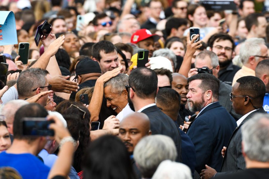 Former president Barack Obama is hugged by supporters after speaking at a rally for Democratic senate candidate John Fetterman in Schenley Plaza Saturday afternoon.