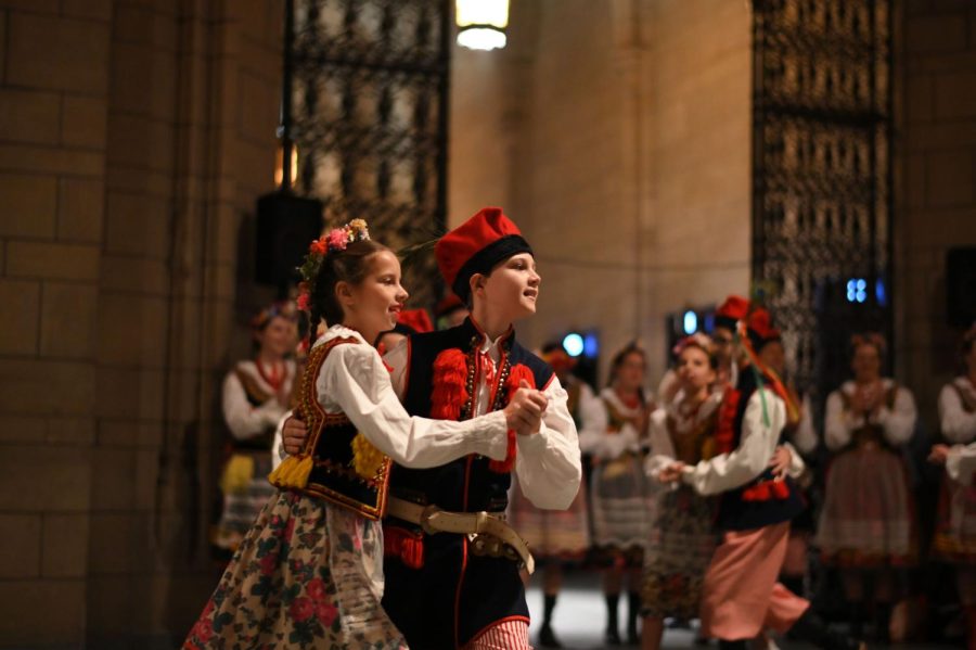 Two children dance during Sunday’s Polish Festival in the Cathedral of Learning. 
