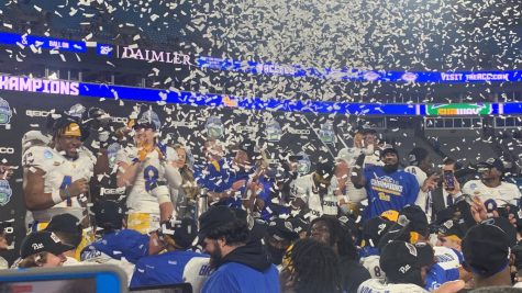 Pitt football players celebrate Pitt’s win over Wake Forest in the ACC Championship game in Charlotte, North Carolina, on Dec. 4, 2021.