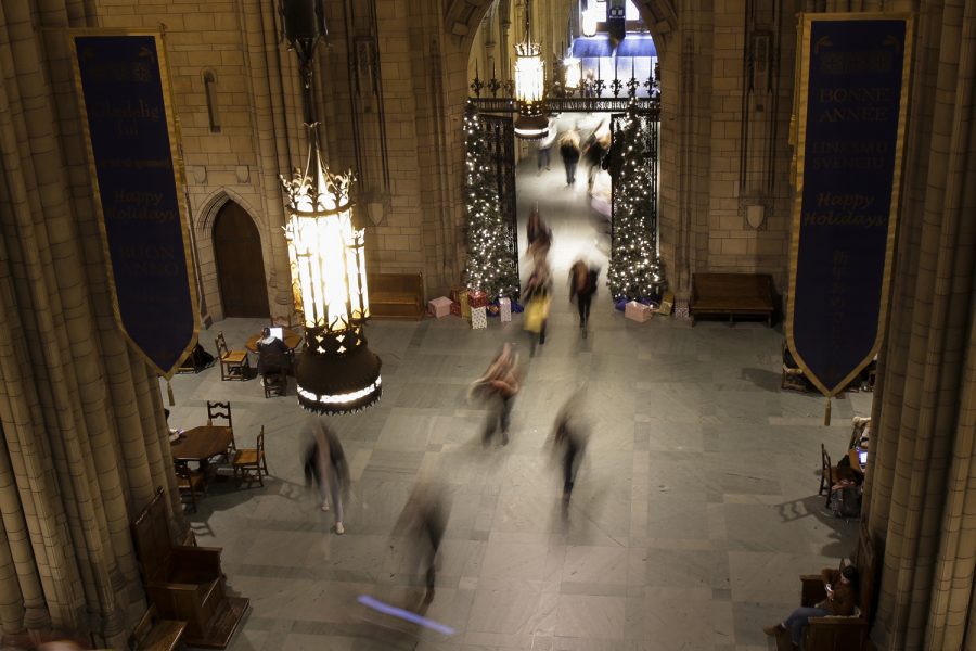 Students walk to classes on the first floor of Cathedral of Learning.