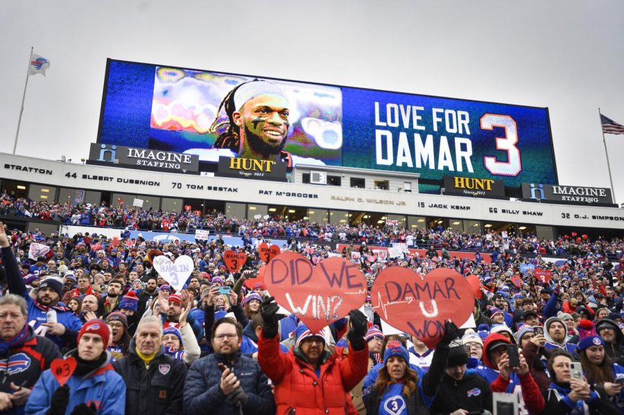 Fans stand in support for Buffalo Bills safety Damar Hamlin (3) before an NFL football game against the New England Patriots, Sunday, Jan. 8, 2023, in Orchard Park, N.Y. 
