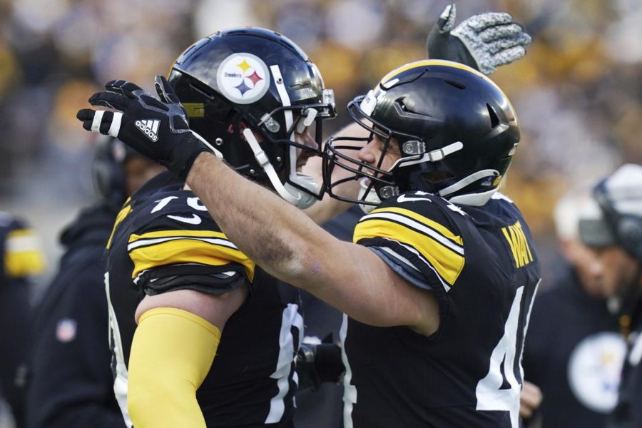 Pittsburgh Steelers fullback Derek Watt, right, celebrates with his brother T.J. Watt after scoring during the second half of an NFL football game against the Cleveland Browns in Pittsburgh, Sunday, Jan. 8, 2023. 