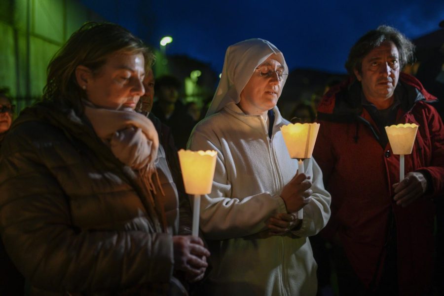 People take part in a candlelight vigil for the victims of a migrant boat that broke apart in rough seas, in Crotone, southern Italy, on Feb. 27.