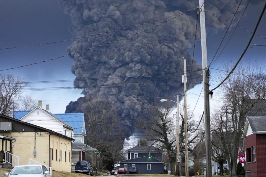 A black plume rises over East Palestine, Ohio, as a result of a controlled detonation of a portion of the derailed Norfolk Southern trains, Feb. 6.