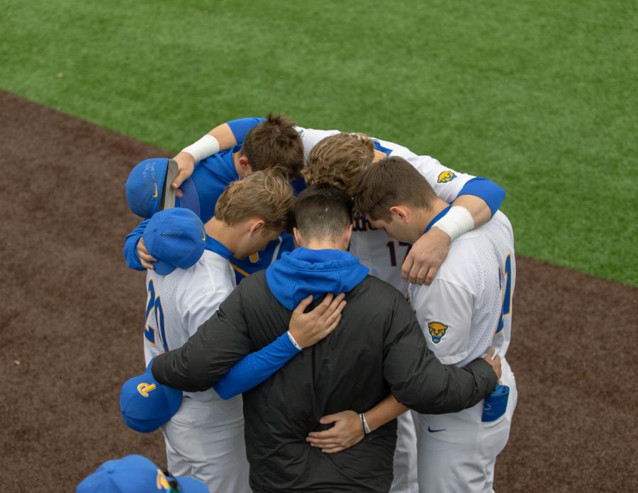 Pitt baseball players huddle during a game against Clemson at the Petersen Sports Complex on March 25, 2022.