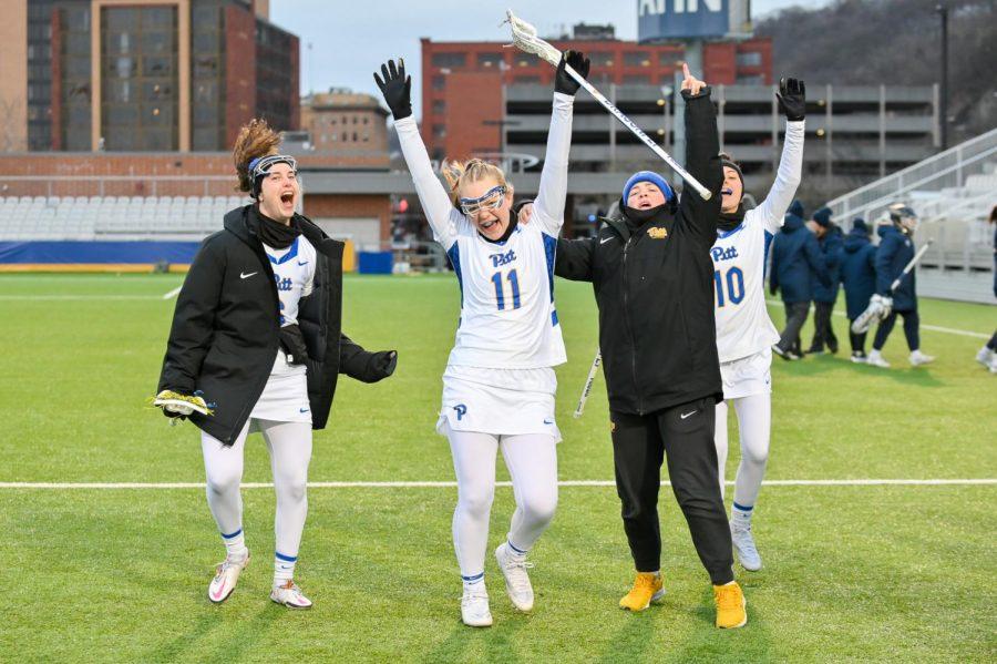 Pitt women’s lacrosse players celebrate after a victory against Akron Monday night.
