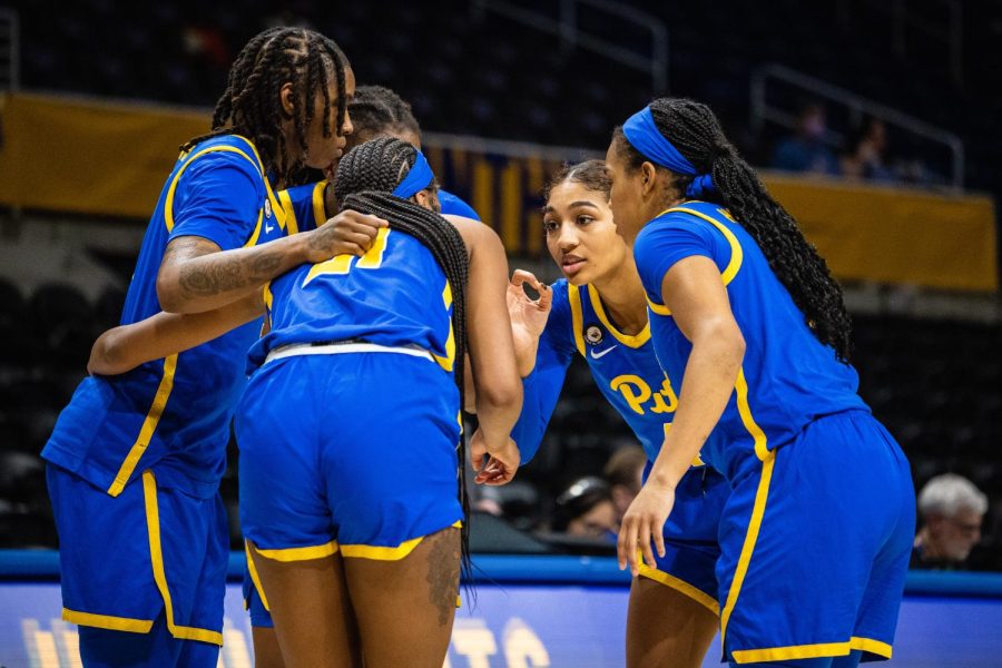 The Pitt Women’s basketball team listens to senior Emy Hayford in the huddle. 
