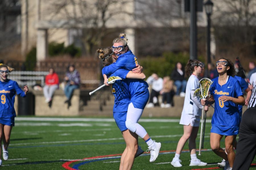 Pitt women’s lacrosse players celebrate during Pitt’s opening season game at Duquesne on Saturday. 
