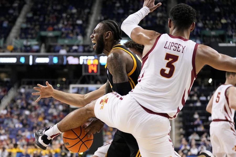 Pittsburgh guard Jamarius Burton is fouled by Iowa State guard Tamin Lipsey during the first half of a first-round college basketball game in the NCAA Tournament on Friday, March 17, 2023, in Greensboro, N.C. 