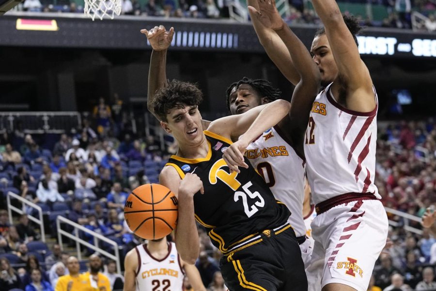 Pittsburgh forward Guillermo Diaz Graham (25) battles Iowa States Robert Jones (12) and Tre King (0) for a rebound during the second half of a first-round college basketball game in the NCAA Tournament on Friday, March 17, 2023, in Greensboro, N.C. 