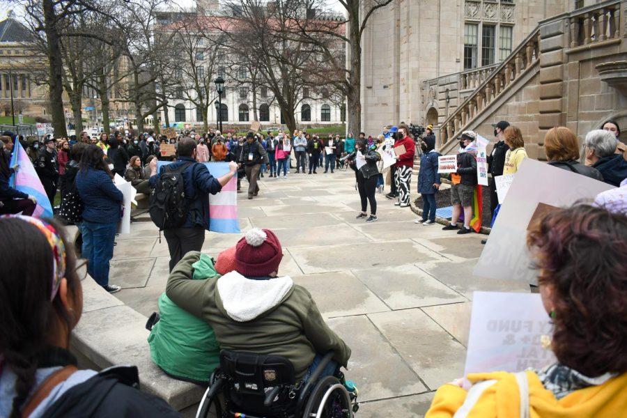 A protester speaks into a megaphone at a protest against the University for allowing Cabot Phillips and other anti-trans speakers to hold events on campus.