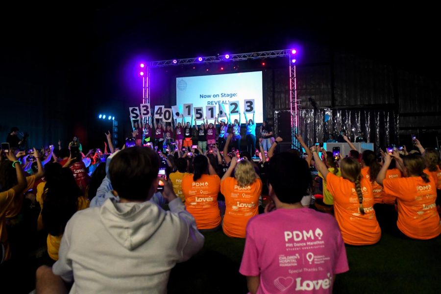 Pitt Dance Marathon staff members share the total fundraising amount: $340,151.23.
