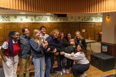 Winning candidates, supporters and current board members celebrate after the Student Government Board announced election results at their weekly meeting Tuesday night in Nordy’s Place.