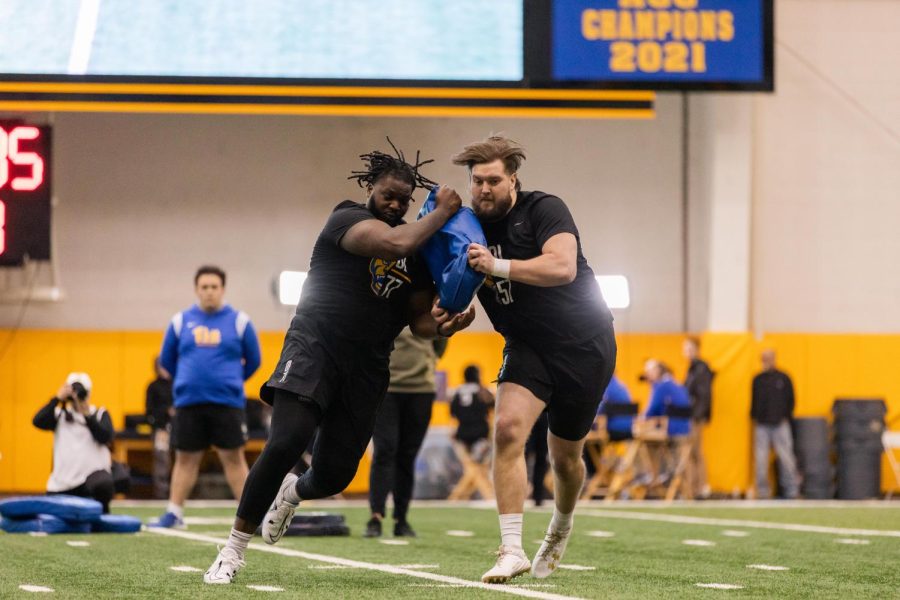 Pitt+football+players+run+with+a+weight+during+NFL+Pro+Day+on+Wednesday.