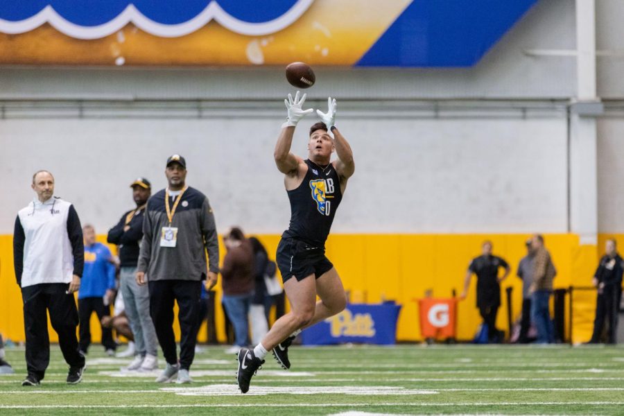 Linebacker John Petrishen (0) catches a football during NFL Pro Day on Wednesday.