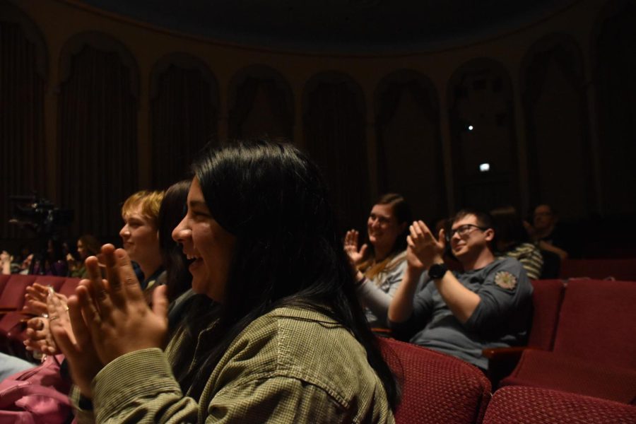 The audience laughs during “No Die to Time” on Sunday in the Frick Fine Arts Building.