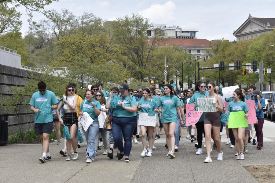Students and community members gathered for the Pittsburgh Universities Believe Survivors March through campus on Sunday. 