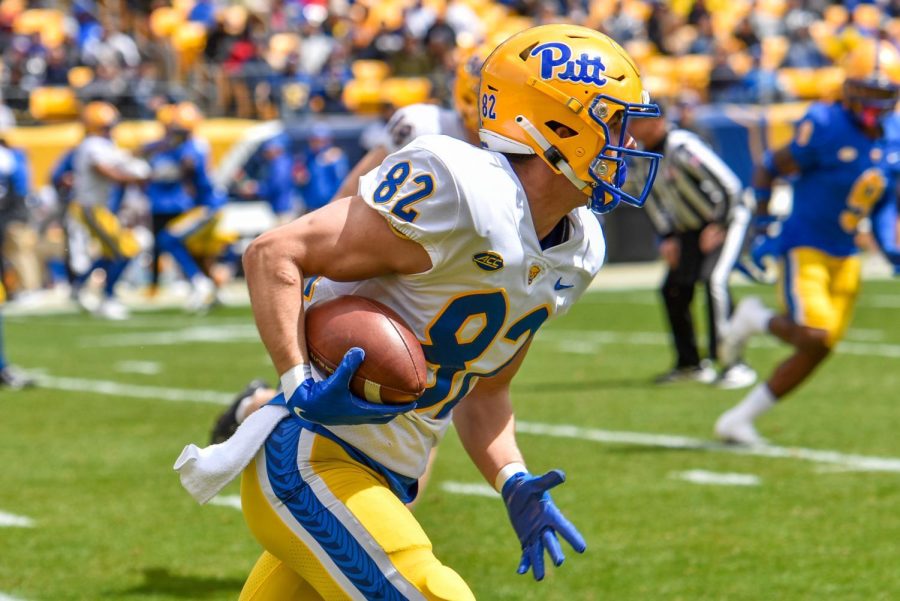 Wide receiver Gavin Thomson runs with the ball during the Blue-Gold spring football game on April 9, 2022.