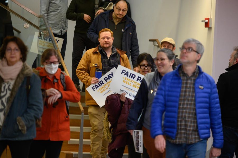 Protestors leave a faculty union protest at Posvar Hall Tuesday morning.