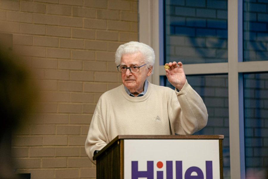 Albert Farhy, a Holocaust survivor, speaks at Hillel Jewish University Center on Forbes Avenue on Monday evening.