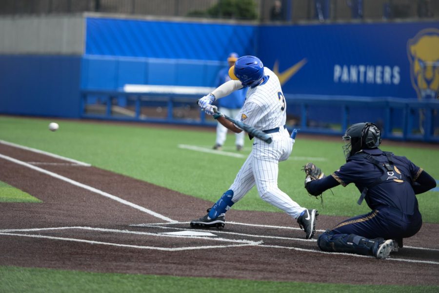 Graduate student infielder Sky Duff (3) hits the ball during a Pitt baseball game against Notre Dame on April 8.