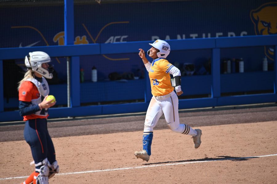 Pitt graduate student infielder Yvonne Whaley (26) runs between bases during a softball game against Virginia on March 26.