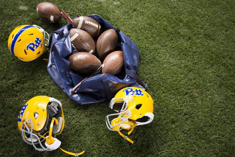 A pile of Pitt footballs.