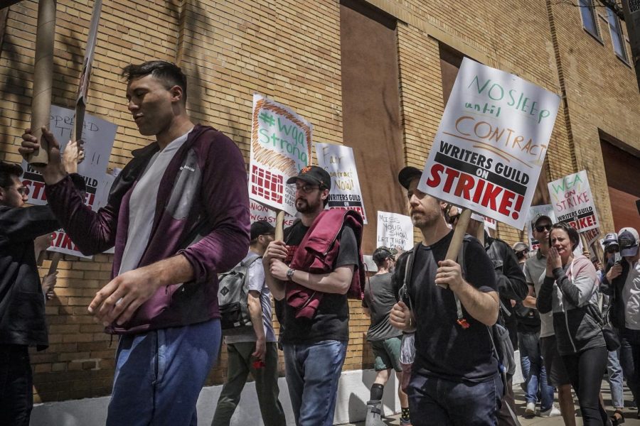 Striking members and supporters of the Writers Guild of America walk the picket line during a rally outside Silvercup Studios, Tuesday May 9, 2023, in New York. 