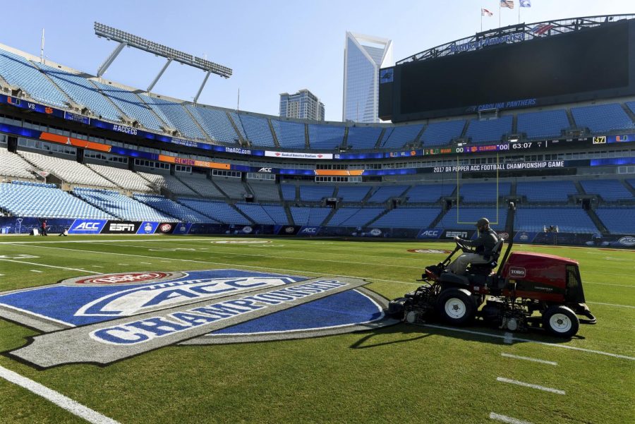 Crews prepare the field at Bank of America Stadium for the Atlantic Coast Conference championship NCAA college football game, Friday, Dec. 1, 2017.