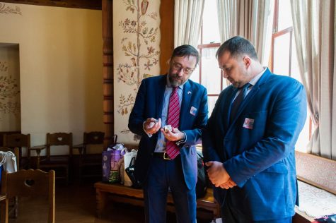 Ambassador Radovan Javorcik (left) and Michal Fedák (right) the Slovak Republic’s state secretary in the ministry of education, science, research and sport, talk about a small box of rocks and minerals in the Czechoslovakian nationality room in the Cathedral of Learning on Thursday. 