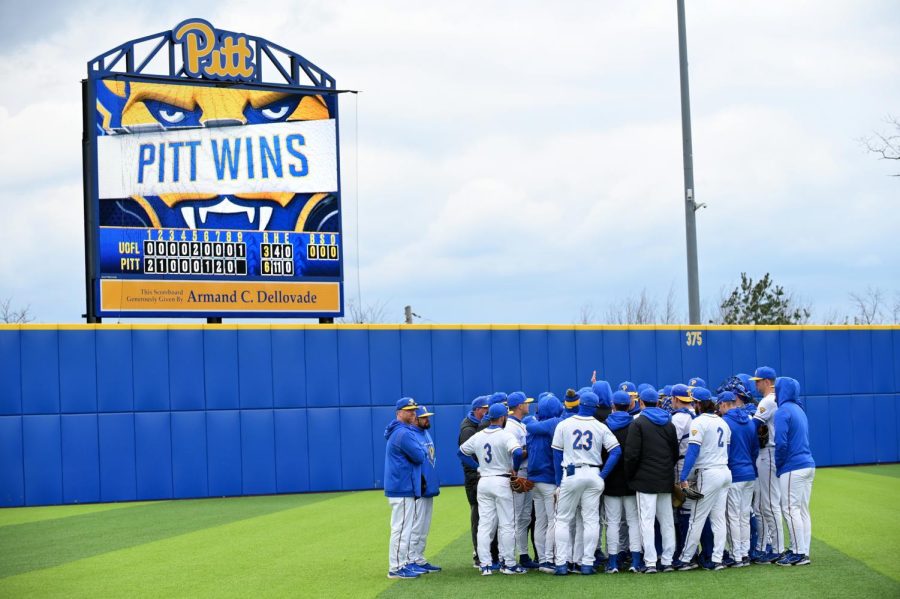 Pitt’s baseball team huddles on the field during its game against Louisville on April 3, 2022. 
