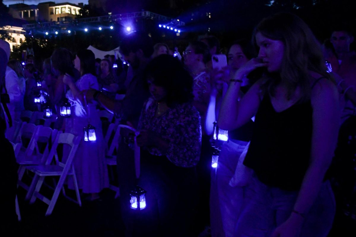 New students hold lanterns during the 103rd Lantern Night on the Cathedral lawn on Sunday evening.